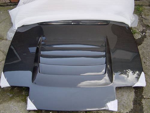 http://www.knightracer.com/images/nissan/s13/S13-DM-Style-Vented-Carbon-Bonnet2.jpg